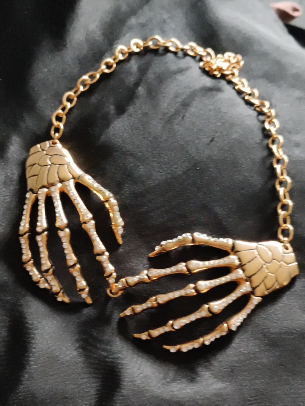 BaubleBar Gold Skeleton Hand Pendant Necklace. Halloween